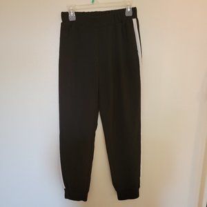 Black joggers with white stripes down sides